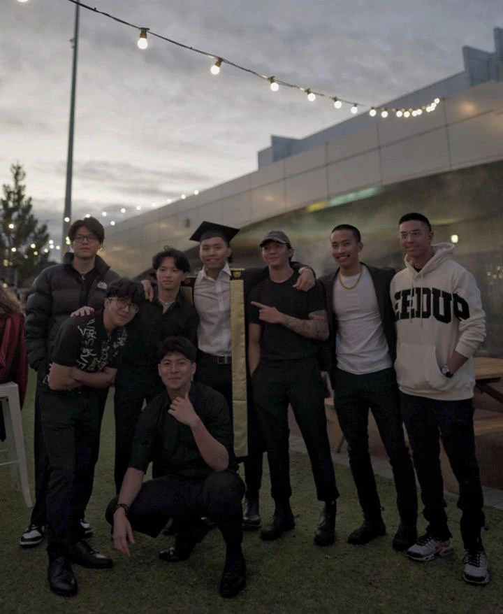 Friends gathered for a graduation celebration outdoors